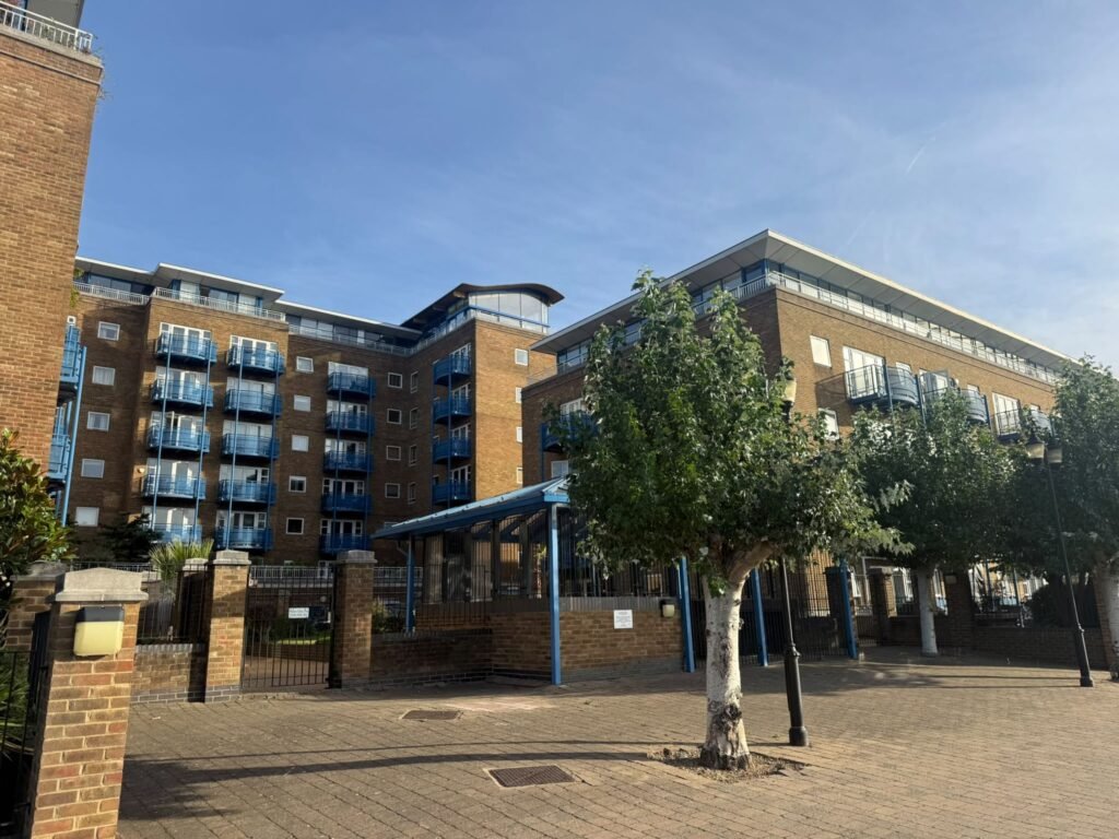 Brick residential blocks with blue balconies at Atlantic Wharf