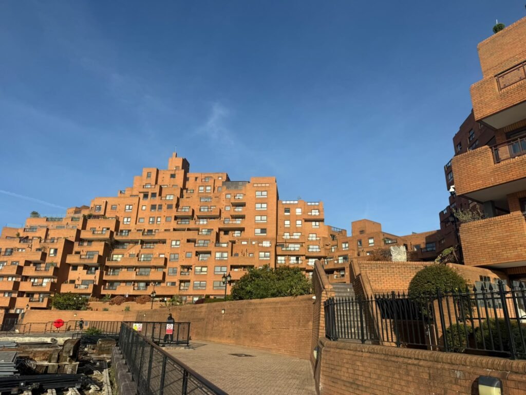 The stepped red brick residential blocks of Free Trade Wharf in Wapping, east London