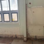 New copper water pipework run at low level along a wall at Kestral House School