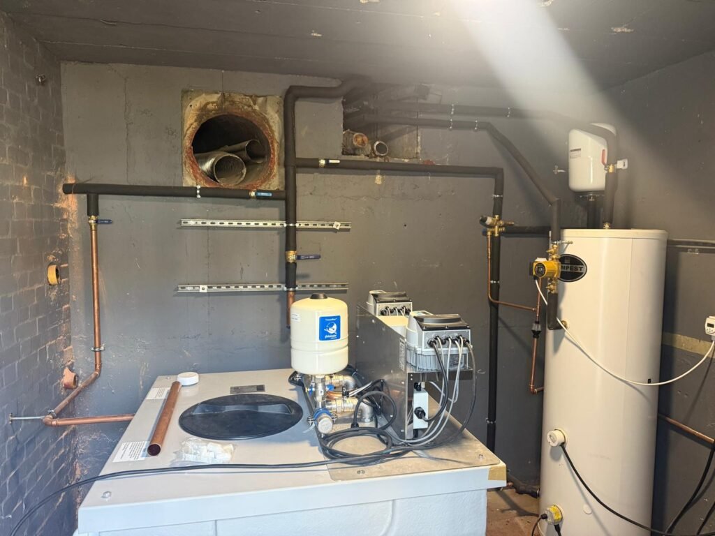Plant room at Kestral House School with the new cold water booster pump set and water heater