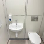 Finished WC and hand basin with concealed cistern panelling at Kestral House School